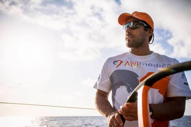 Onboard Team Alvimedica – Mark Towill on the helm shortly after sunrise - Leg six to Newport – Volvo Ocean Race 2015 ©  Amory Ross / Team Alvimedica